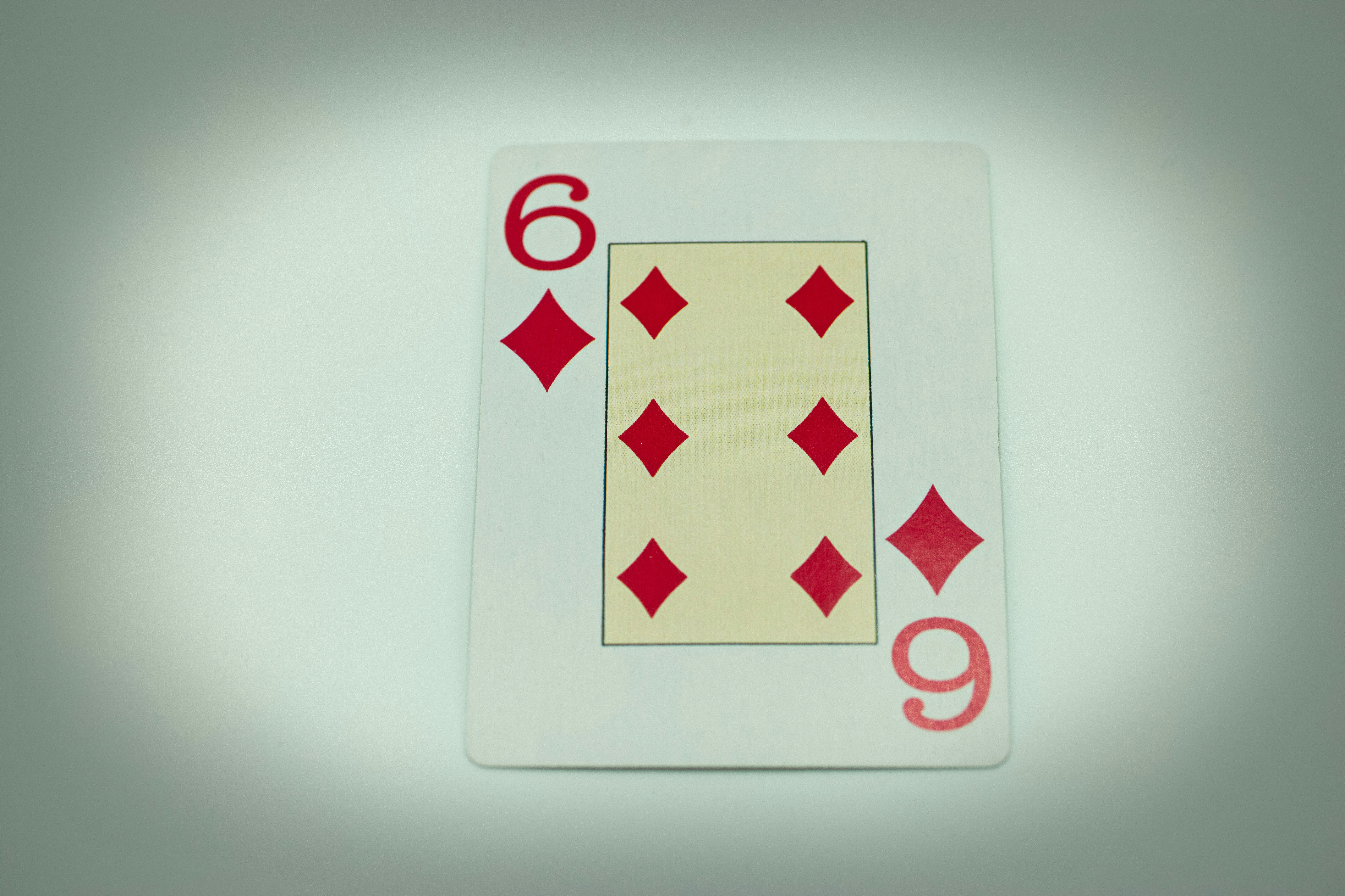 a close up of a playing card on a table